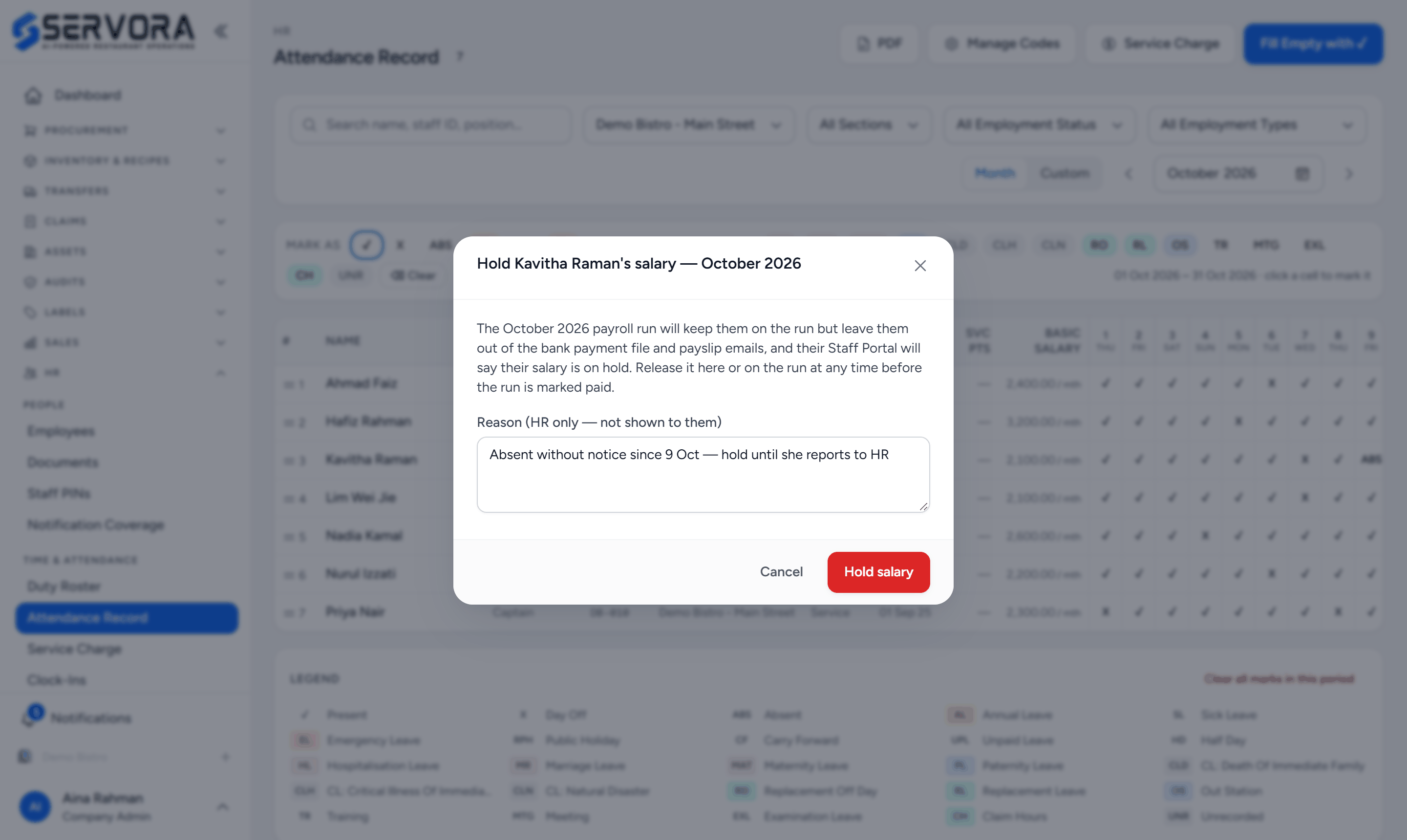 The Hold salary dialog over the Attendance Record: Hold Kavitha Raman's salary for October 2026, an explanation of what the payroll run will do, a reason only HR sees, and the Hold salary button