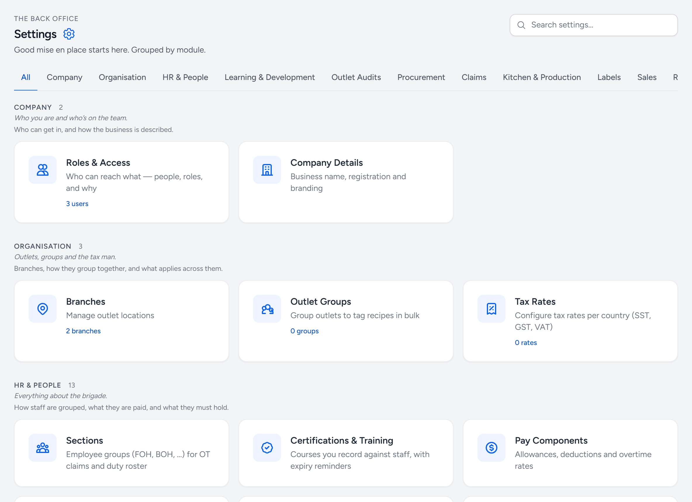 The Settings page: a search box, tabs for each module from Company to Sales, and tiles for Roles and Access, Company Details, Branches, Outlet Groups and Tax Rates